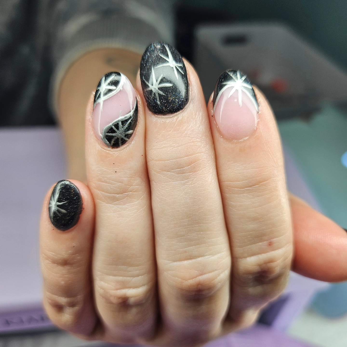 Black star sparkle nails