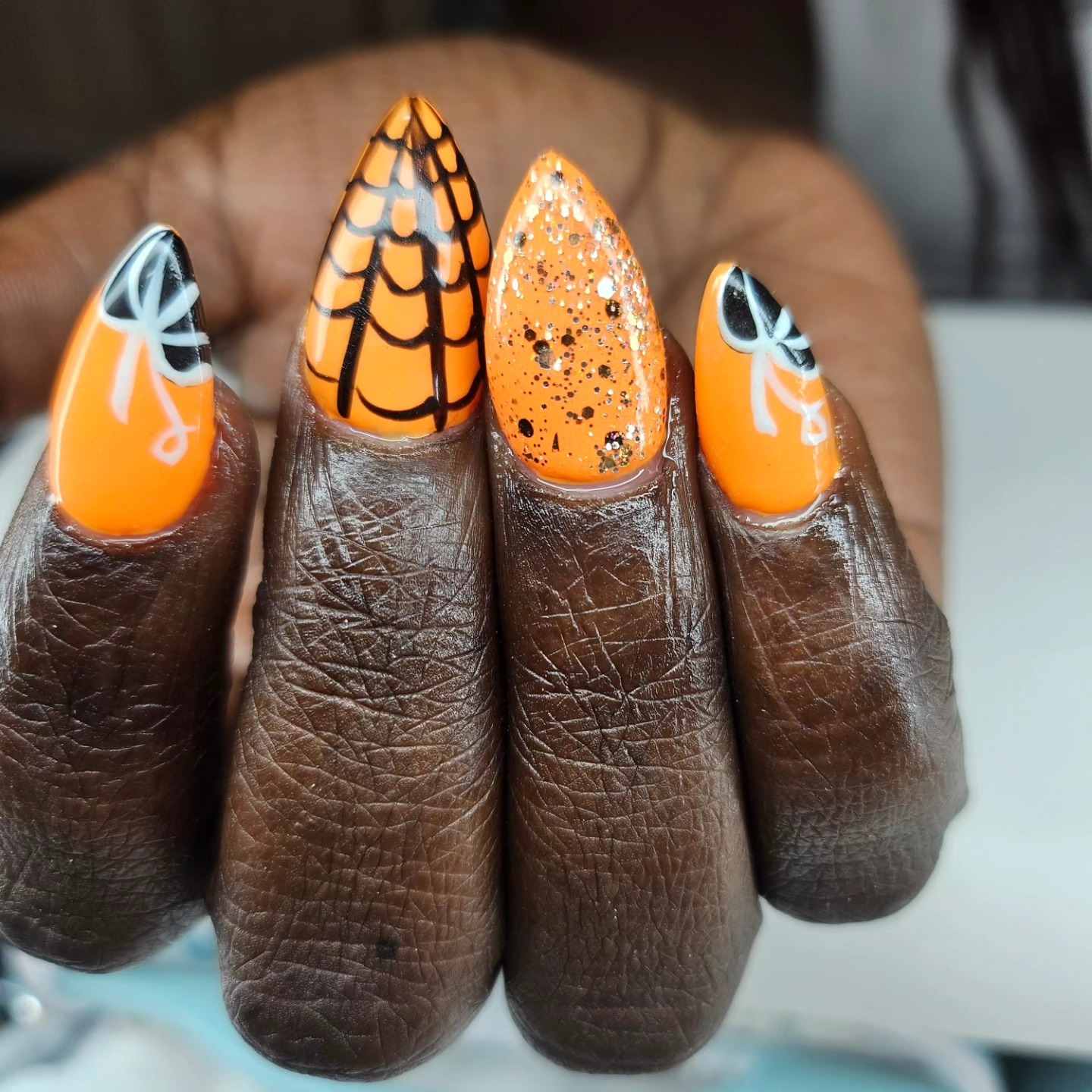 Orange Halloween spider web nails