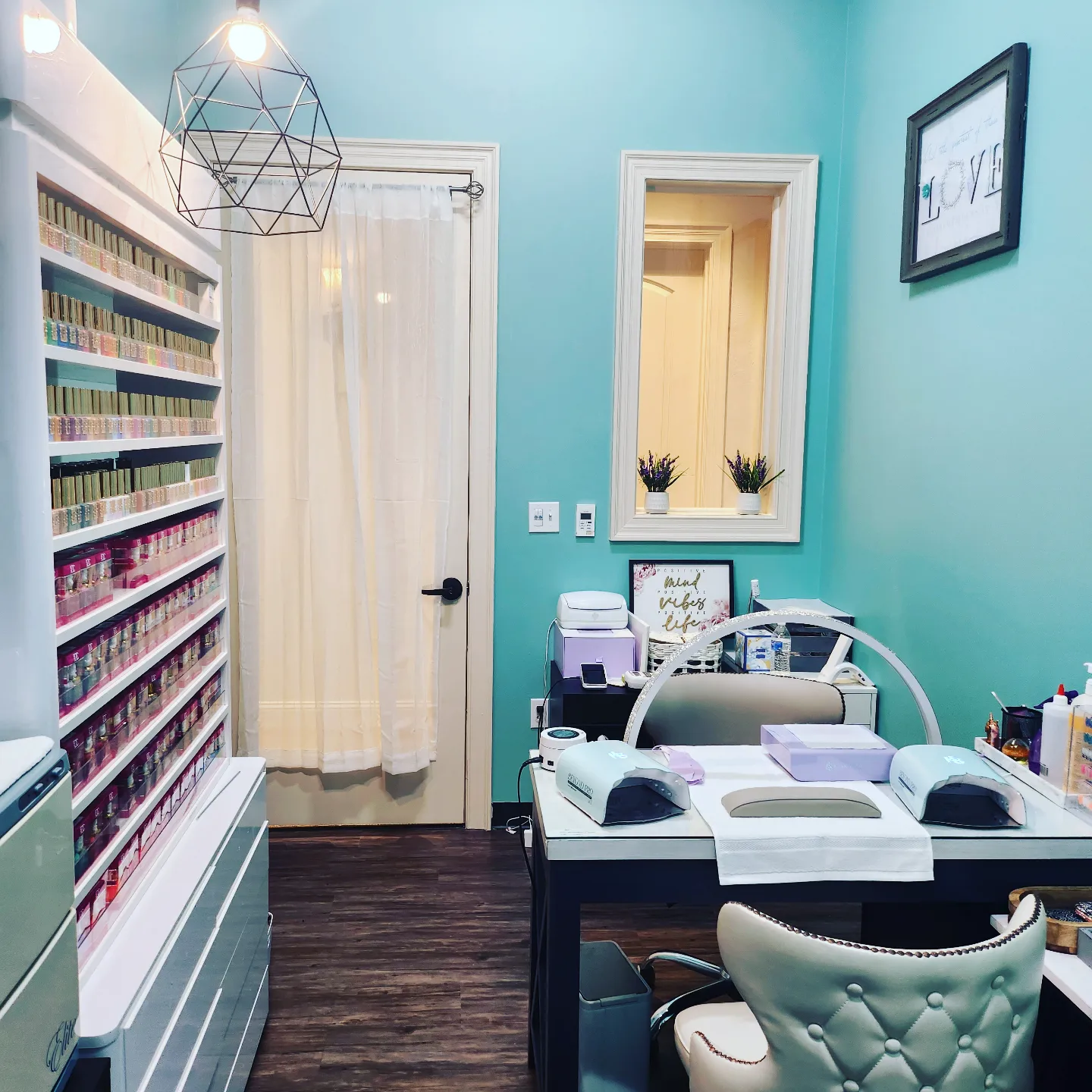 Sun's Nail Studio polish wall and nail station